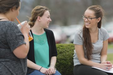 Campus Scenic - Students Talking by bushes - Spring 062