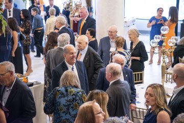 Guests chat with each other at the Community Dinner.