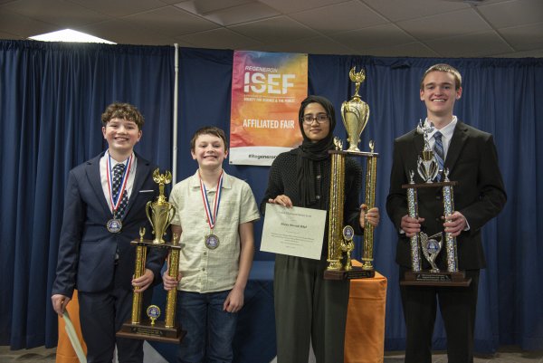 2026 Regional Science Fair Champions stand with their awards.
