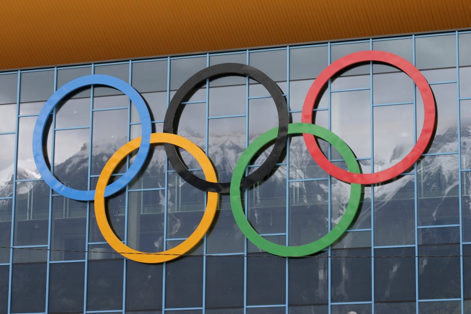 Olympic Rings on side of glass windows.