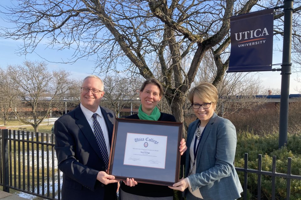 Professor Sara Scanga with Provost Todd Pfannestiel and President Laura Casamento receiving the Harold T Clark Award.