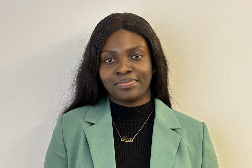 Maame Yaa Boakye, Class of 2020, in black shirt and green jacket.