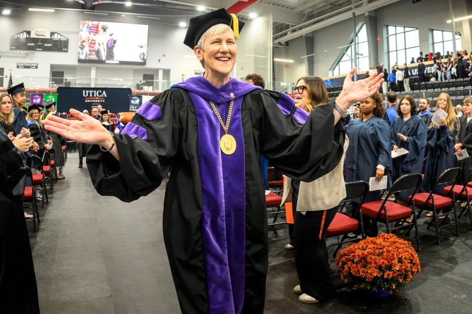 President Stephanie Nesbitt exits past the crowd at her presidential inauguration.